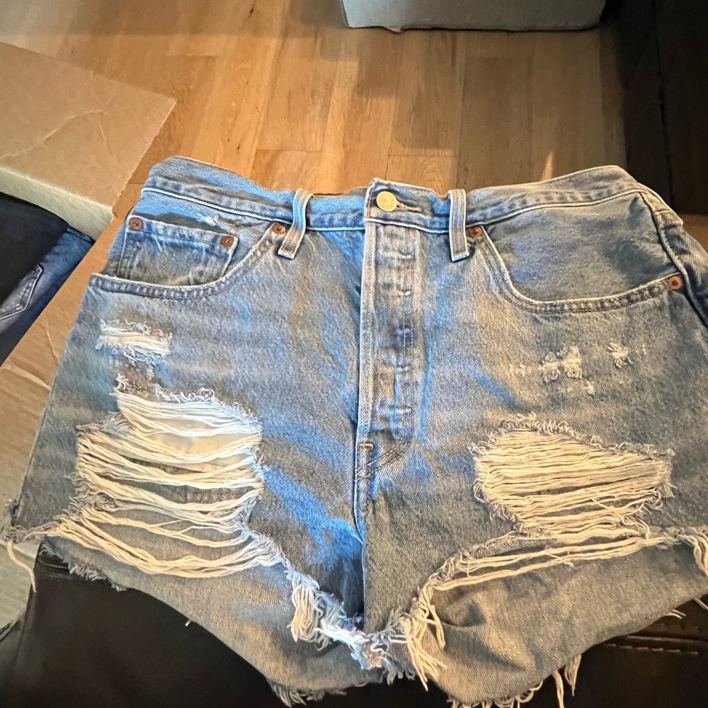 Distressed Levi 501 Jean shorts
Size 31 2 inch inseam button